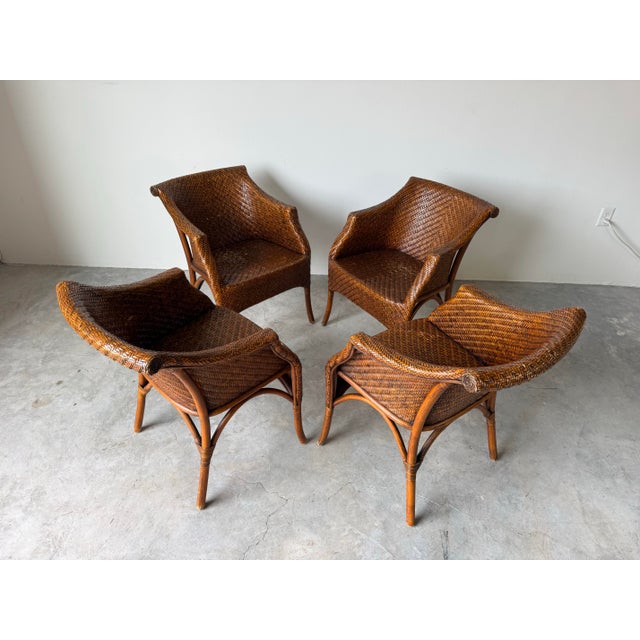 Beautiful set of four vintage Palecek-style dining chairs featuring an elegant, organic coastal design. These chairs are...