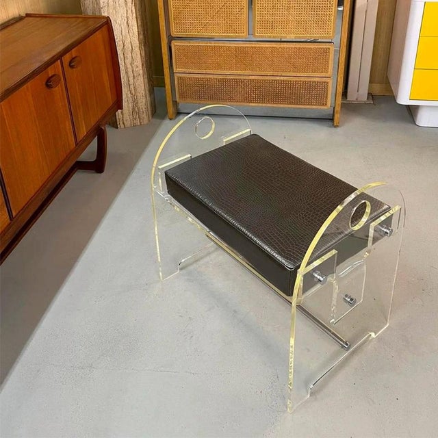 This Post-Modern vintage 1970s acrylic vanity bench has a unique quality. As one moves about the stools, you will notice...