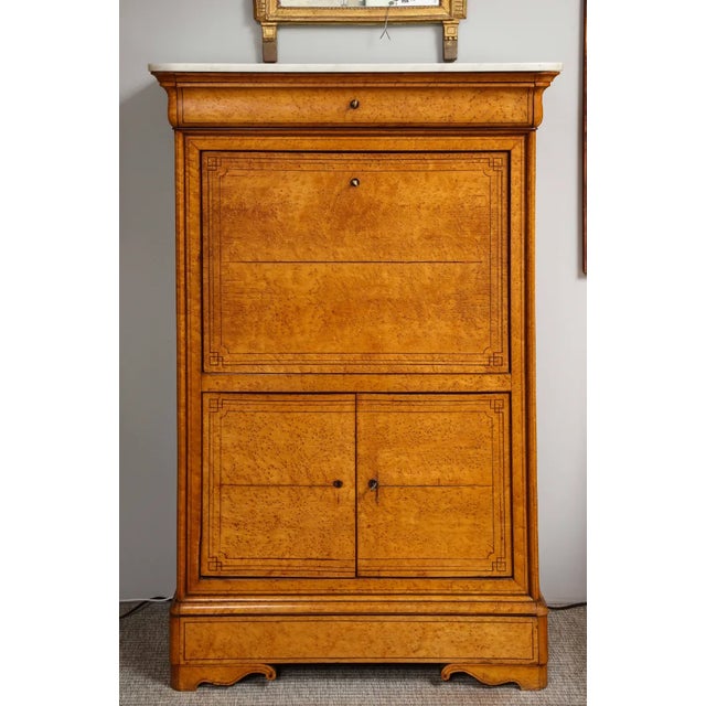 A 19th-century secrétaire abattant of exceptional quality. This beautiful piece consists of a center cabinet with a tooled...