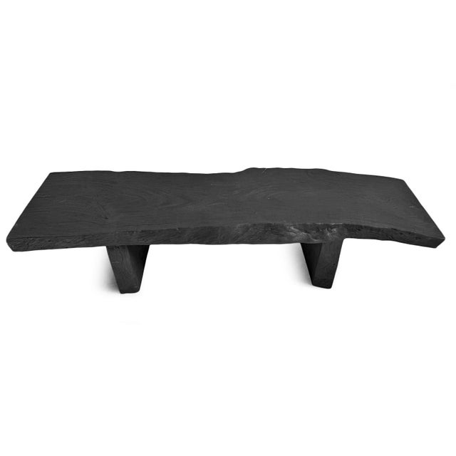 Handcrafted from a large live-edge wood slab, this striking bench or coffee table showcases the organic beauty of natural...