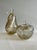 Exquisite two-piece set of decorative glass sculptures in the shape of an apple and a pear, meticulously handcrafted by...