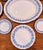 Create an instant collected plate wall with this nine-piece set of vintage Wedgwood Embossed Queen’s Ware in the sought-...