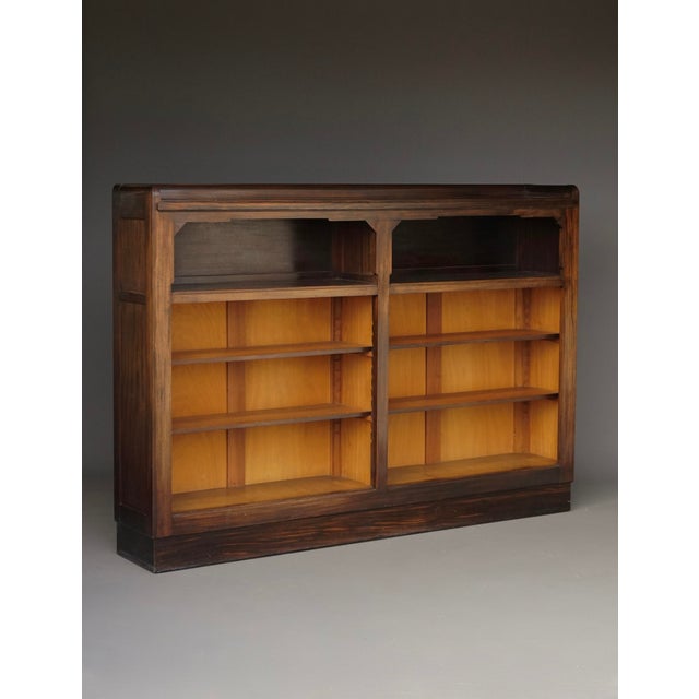 A good quality Dutch art deco walnut and stained beech wood bookcase in 1920s Amsterdam School style. The design is...