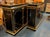 This product is a charming pair of Continental Louis XVI black lacquered chests with bronze accents. These chests are...