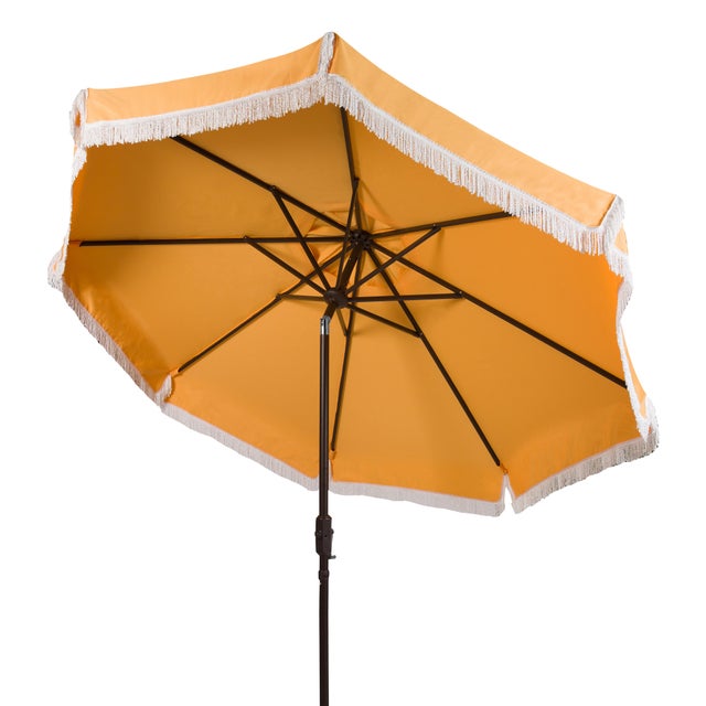 Summer afternoons at an exclusive private members club inspired this posh nine-foot crank umbrella. it's classic yellow...
