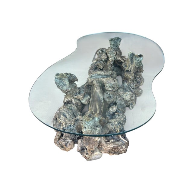 This exceptional organic modern cocktail table is a true sculptural statement piece, handcrafted from an extraordinary...