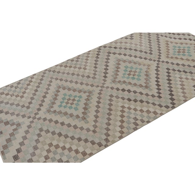 Handknotted in wool, this 4x7 vintage Art deco Zeki Múren rug originates from Turkey, circa 1960-1970 and is latest to...