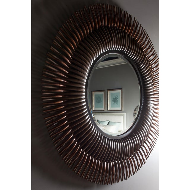This piece is available only as shown, and will ship in 2-3 weeks. An elegant and striking round mirror from Century...