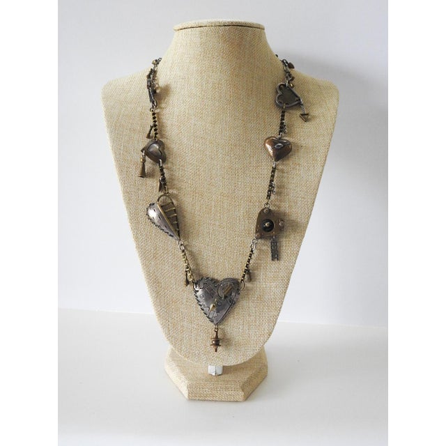 Vintage sterling silver and brass Thomas Mann heart charm necklace. Intricate detailed techno romantic components. Main...