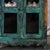 Antique Indian Painted Cabinet, with a scalloped top gallery and pierced lower apron, and a scalloped interior shelf...