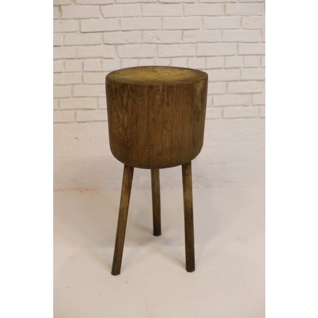 Handsome butcher block table in solid oak. Simple construction consists of a round, charmingly aged oak top with lots of...