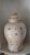 Asian Ginger Jar w/Lid and Calligraphy and Bird Decorations. Good condition with some lid damage. Pale Oatmeal Color