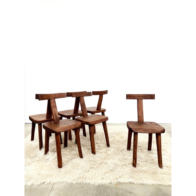 This set of six elm chairs by the manufacturer Aranjou are true icons of rustic and brutalist French design from the...