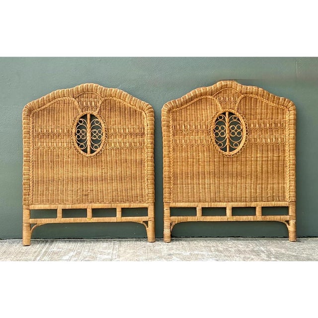 This vintage pair of twin headboards is richly woven in golden-toned wicker and rattan, with a softly scalloped, arched...