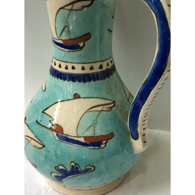 Turkish turquoise jug decorated with sailboats or tirenes and cobalt blue clouds. Blue decorated handle. Circa 1970. Great...