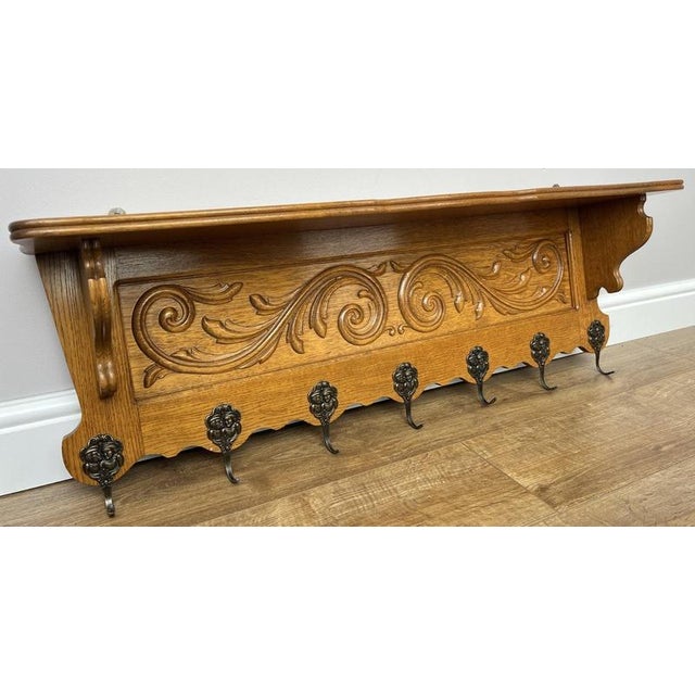 A striking Vintage French coat hanger, beautifully crafted with detailed carved decoration and a practical wall-mounted...