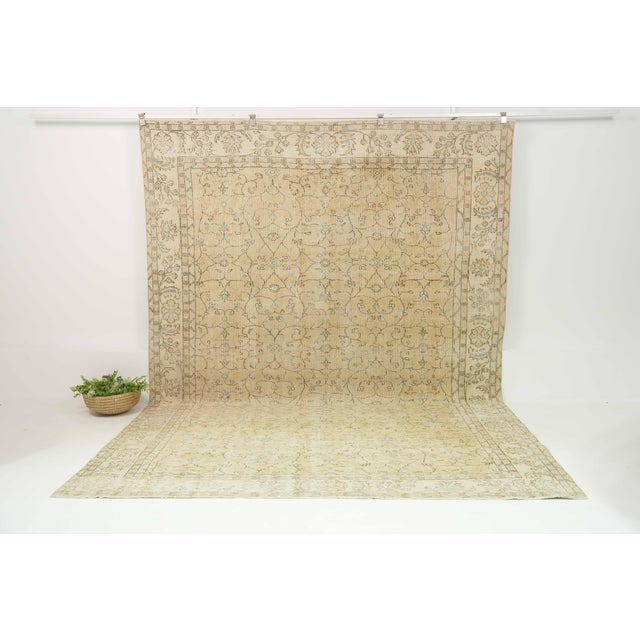 This vintage hand-knotted area rug is a semi-antique vintage area rug. The '70s Eastern Anatolian region's unique rug is...
