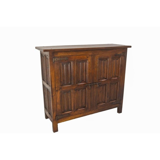 Spanish credenza sideboard dresser buffet, made circa 1960 The two doors of this buffet are carved with motifs for...