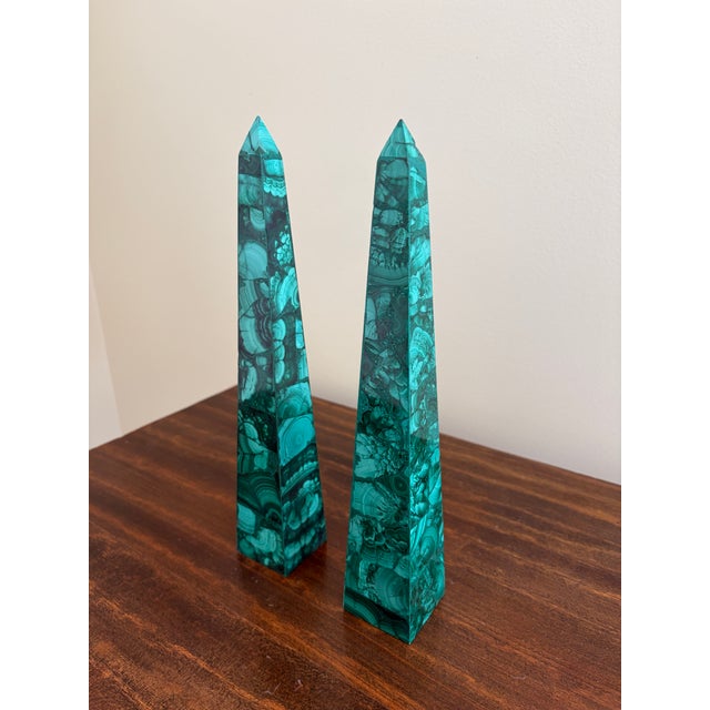 A stunning pair of neoclassical or Grand Tour style malachite obelisks Late 20th Century Measures: 2"W x 3275"D x 11.5"H....