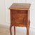 French bedside table in the louis xv style, likely made around 1900 during the historicist revival of the rococo. The...