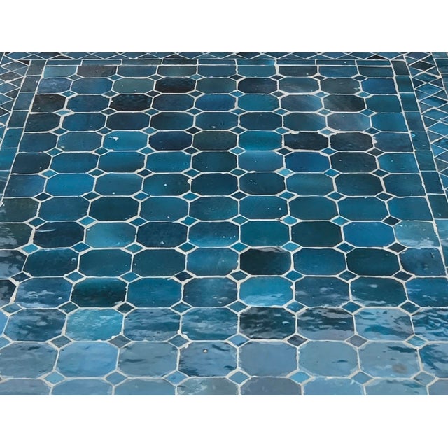 Bring authentic Moroccan craftsmanship to your home or patio with this striking Petrol blue mosaic table. The rectangular...