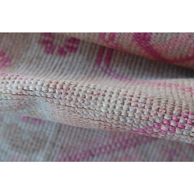 This spectacular Turkish long runner rug was handmade in Anatolian lands in the mid 20th century. This Vintage Oushak...