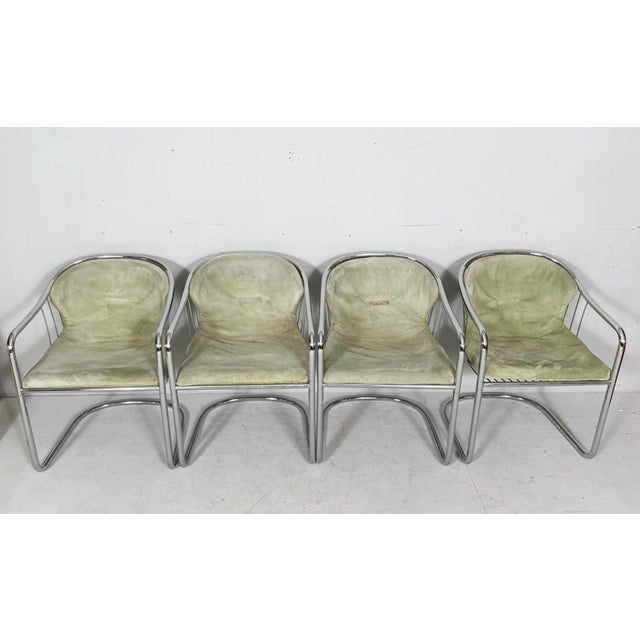 Four cantilever chairs with armrests by gastone rinaldi, italy, 1970s, solid construction made of chromed steel, with four...