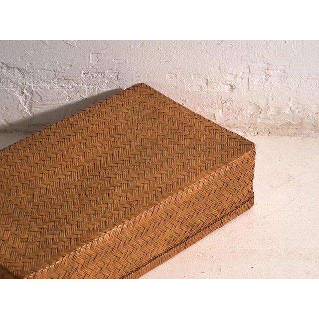 This set of two antique japanese box in woven bamboo is made of two storage containers with a fitted lid, low and...