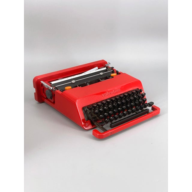 A typewriter * manufacturer: olivetti * designers: ettore sottsass and perry king (designed 1969) * material: metal,...