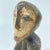 A hand-carved Lega figure originates from the Lega people in the Democratic Republic of the Congo. The figure is easily...