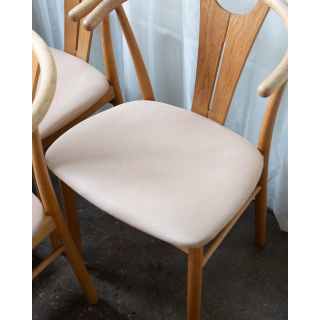 Set of six Danish wishbone-style dining chairs, circa 1970s, inspired by Hans Wegner’s iconic sculptural form. Crafted in...
