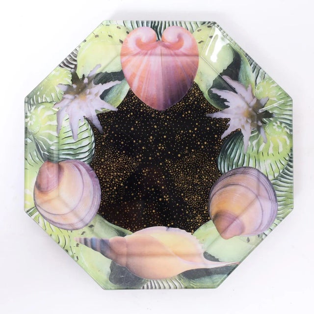 Striking set of six glass plates with an octagon form decorated with seashells in a whimsical reverse decoupage technique....