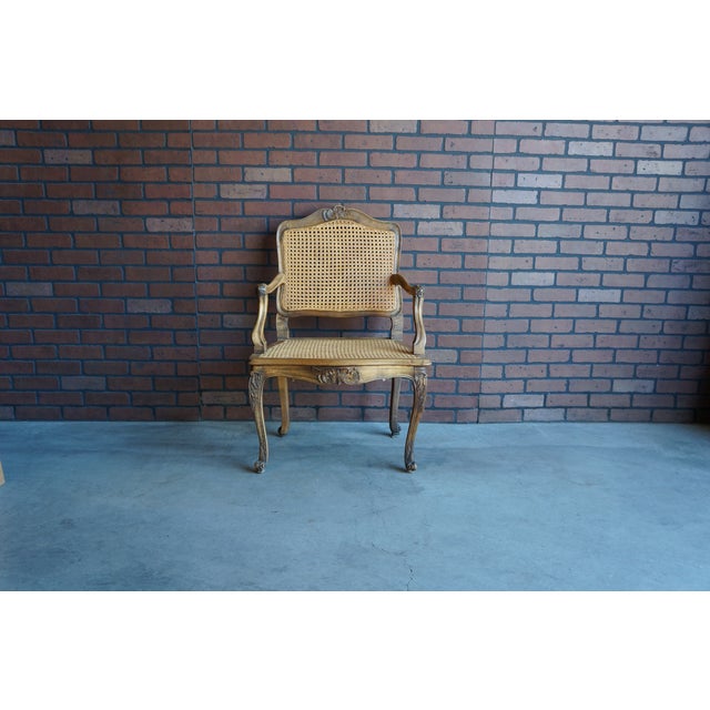 Perfectly Paired! Old-World Parisian elegance abounds in these antique French walnut cane chairs. These chairs will be the...