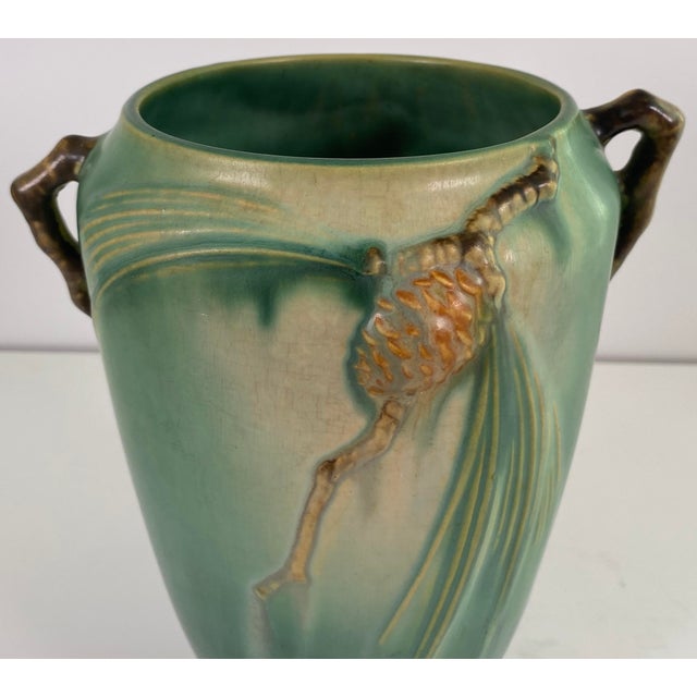 A highly collectible American art pottery vase from the renowned Roseville Pottery Company, executed in the iconic...