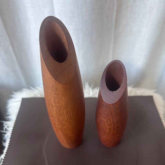 A pair of really cool modernist MCM solid staved teak bud vase, circa the 1970s. The vases are in very good vintage...