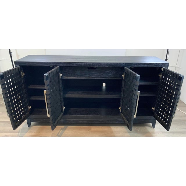 Stylish Modern Black Cerused Oak Finished Four Door Credenza, webbed fabric doors, five shelves, one drawers, polished...