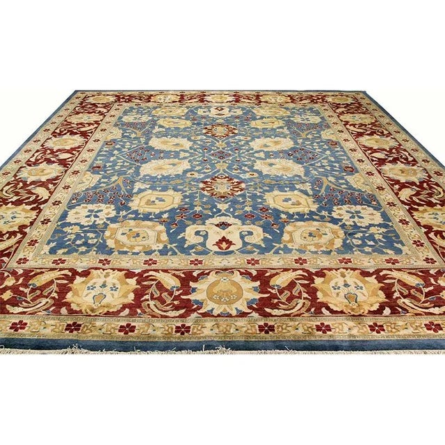 ACTUAL SIZE: 12’0″ x 15’3″ PRIMARY COLOR: Blue / Red AGE: New (Made in the 1990s and never been used) ORIGIN: Pakistan...