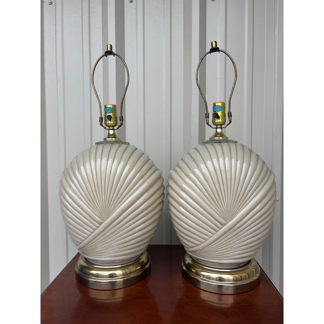 Make a sophisticated statement with this striking pair of sculptural ceramic table lamps, beautifully designed in the...