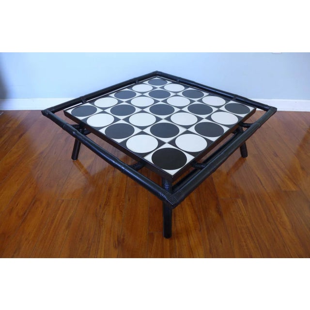 Op Art Tile Top Rattan Cocktail Table Unique Mid Century op art coffee table will be the star of any room. Tile top is...