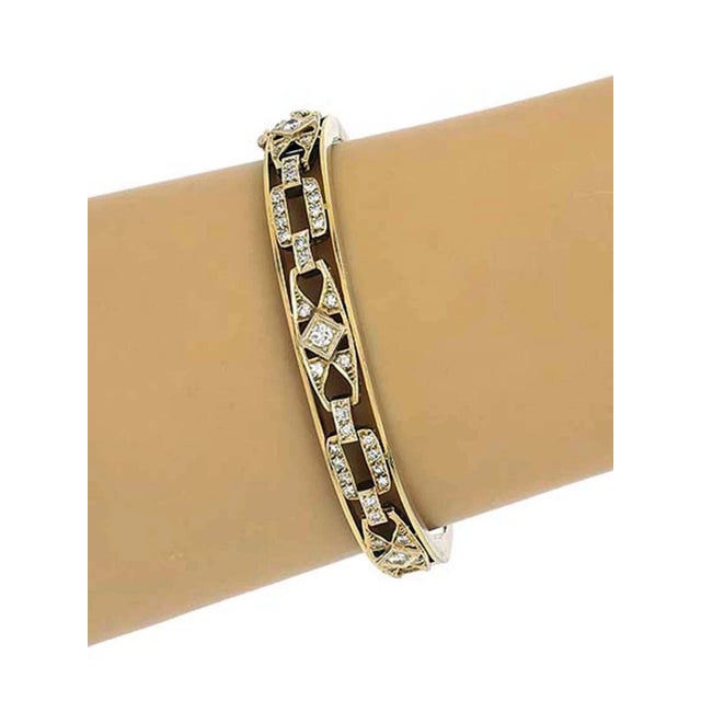 This product is a vintage 14k yellow gold open design bracelet, featuring a bangle style and fine jewelry department. The...