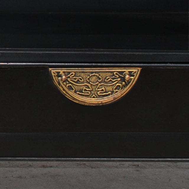 A pair of Asian inspired nightstands by Century Furniture. Ebonized with brass pulls on drawer at bottom. Ample open area...