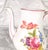 This is a white Hutschenreuther coffee pot in an unknown pattern. I have not been able to find any pattern with pink trim....