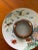 Beautifully colored and designed Asian ashtray in near perfect condition. The raised center edge has a gold rim and a...