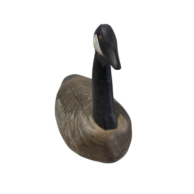 Vintage 20th century hand-carved and hand-painted solid wood Canada Goose decoy. This substantial piece measures 18" deep...