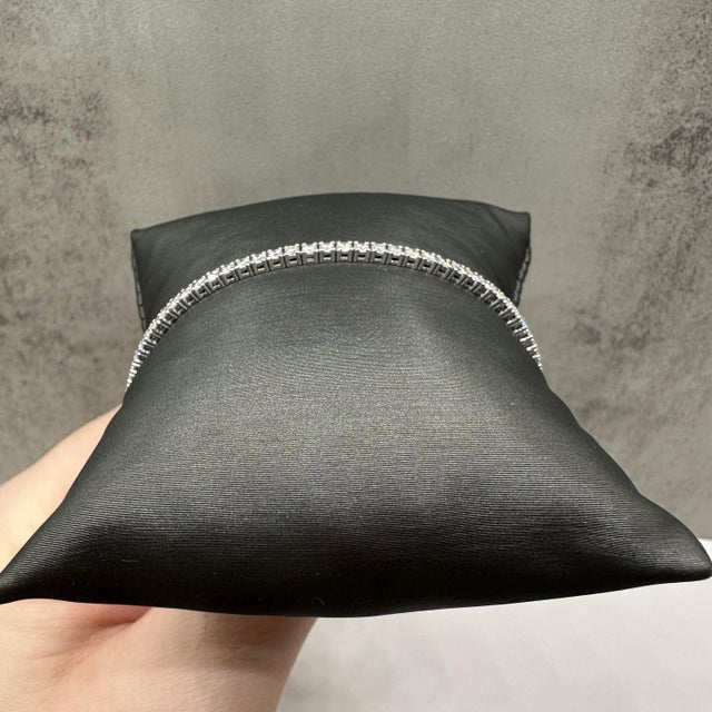 This elegant natural diamond tennis bracelet in 14kt white gold features 2.5 carats total weight of GH SI round diamonds,...