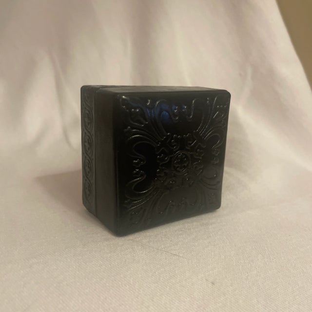 Italy. Hand tooled embossed square dark green nearly black box with separate lid. Fleur de lis and guilloche decoration