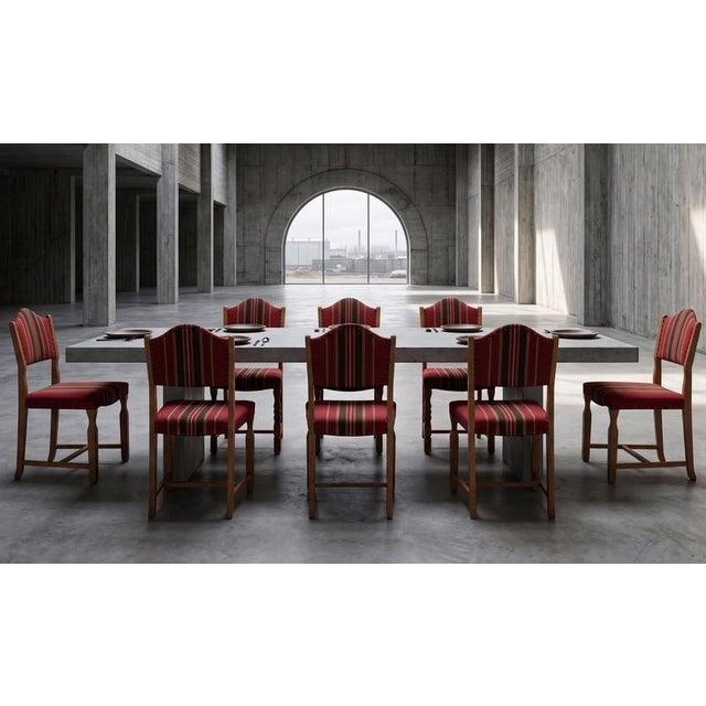 Set of solid oak dining chairs attributed to Danish designer Henning Kjærnulf, crafted in Denmark during the 1960s....