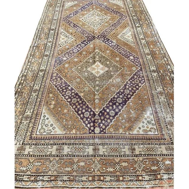 ACTUAL SIZE: 6’9″x13’1″ PRIMARY COLOR: Peach / Purple. Ivory AGE: Antique MATERIALS: Wool FOUNDATION: Cotton PRODUCTION:...