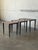This elegant set of three nesting tables features a clean and highly functional minimalist silhouette. The graduated...