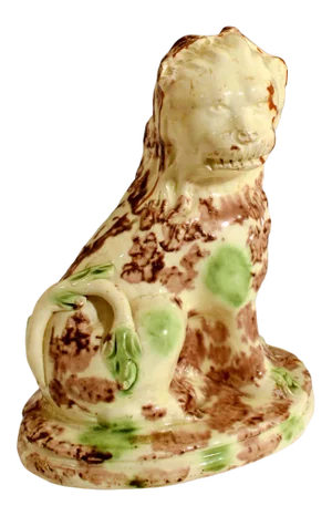 English Creamware Pottery Model of a Seated Lion, With a Whieldon-Type Tortoise-Shell Glaze, Circa 1765-85